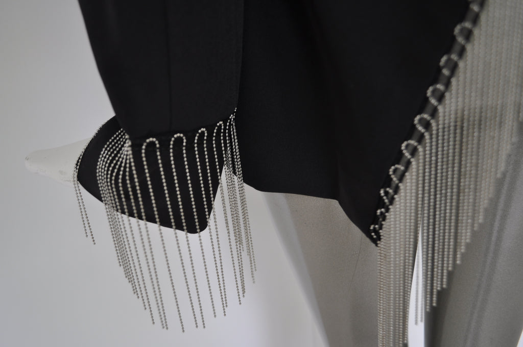 Avantgarde jacket with metal strings attached