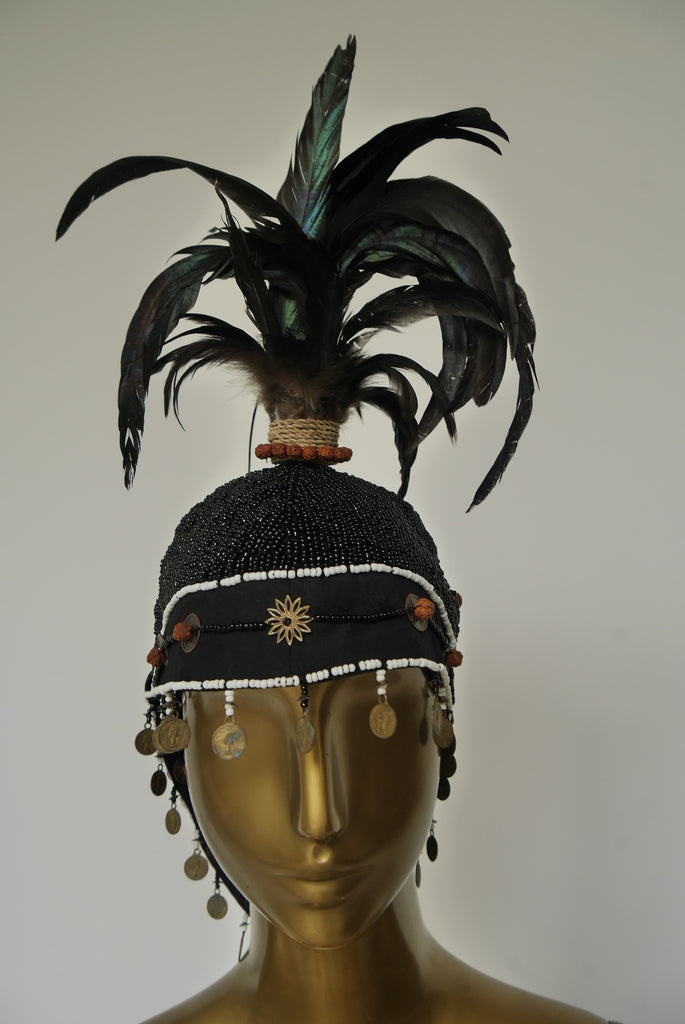 Handmade beaded balinesian cap with feathers. Tribal folk art Bali Indonesia