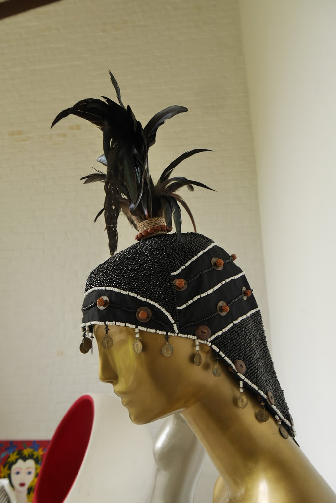 Handmade beaded balinesian cap with feathers. Tribal folk art Bali Indonesia