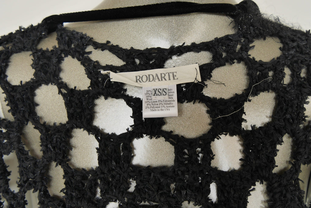 Slashed Bohemian style knit vest by Rodarte